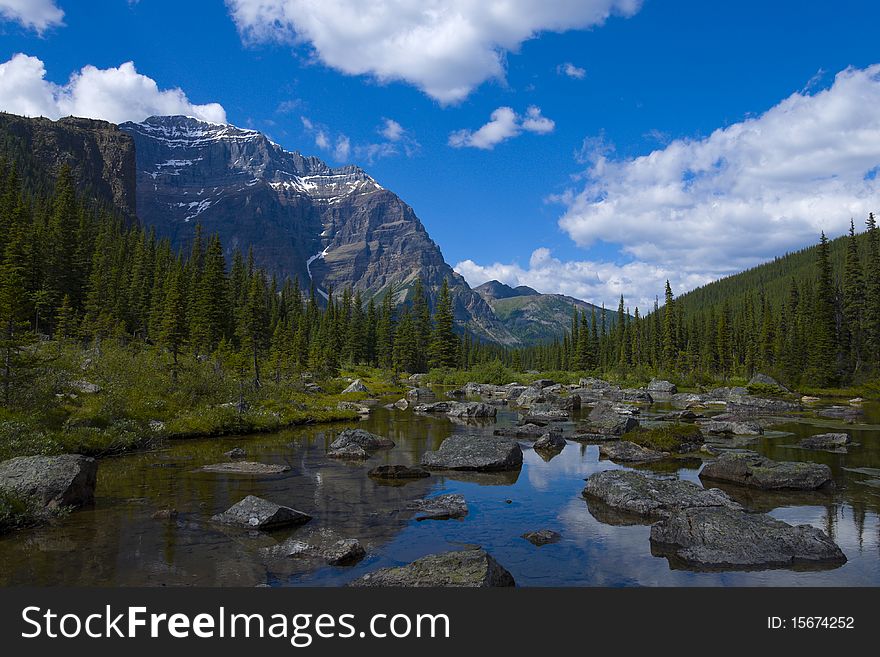 At the end of a hiking trail you'll find Consolation Lake in Banff Natinal Park, Alberta, Canada