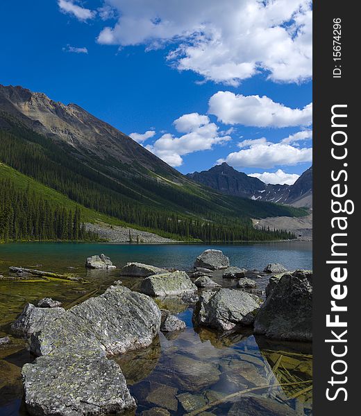 At the end of a hiking trail you'll find Consolation Lake in Banff Natinal Park, Alberta, Canada