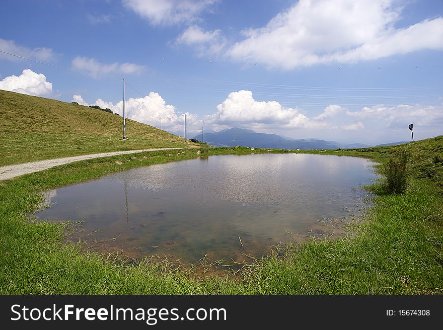 Pontogna (Bs), Trompia Valley, Italy,a natural pond in a pasture in the hills