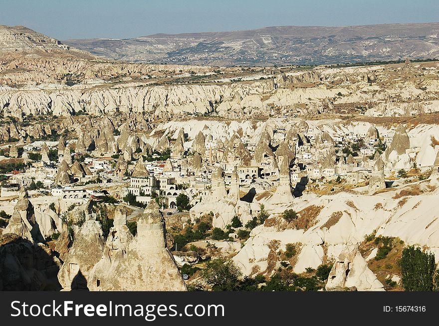 Town in Cappadocia, cliffs around it, attonishing natural wonder