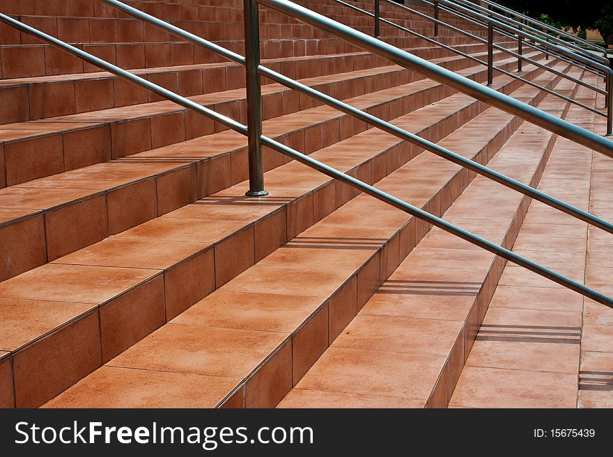 The brown stair have metal handle