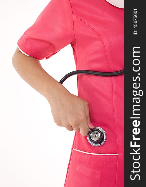 A female nurse hand want to keep the stethoscope into uniform pocket. A female nurse hand want to keep the stethoscope into uniform pocket