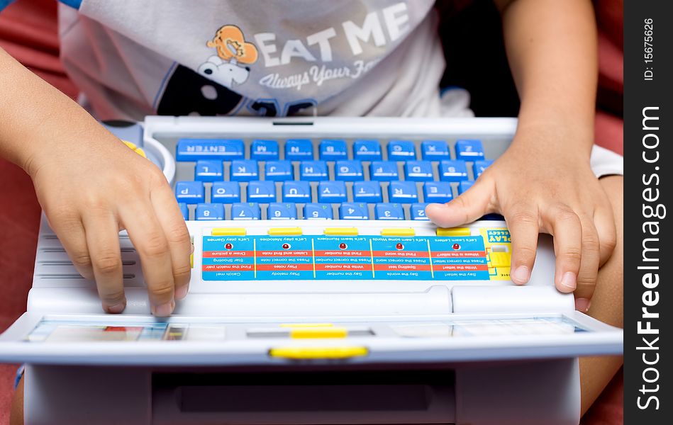 Boy hand with toy laptop. Boy hand with toy laptop