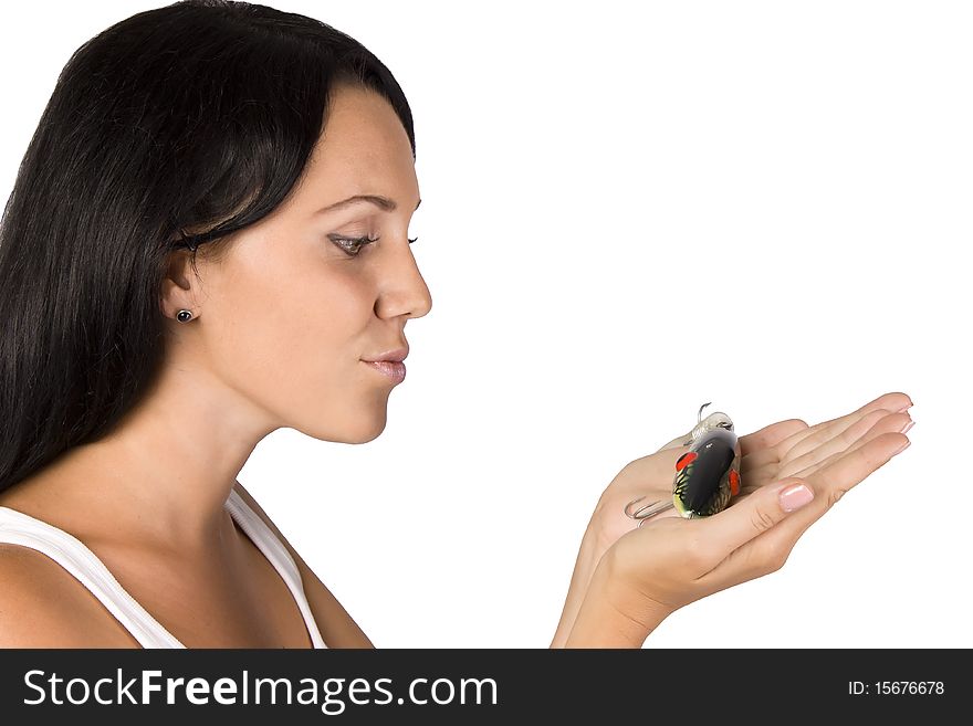 Isolated shot girl in a pink shirt with a fishing lure on the jeans. Isolated shot girl in a pink shirt with a fishing lure on the jeans.