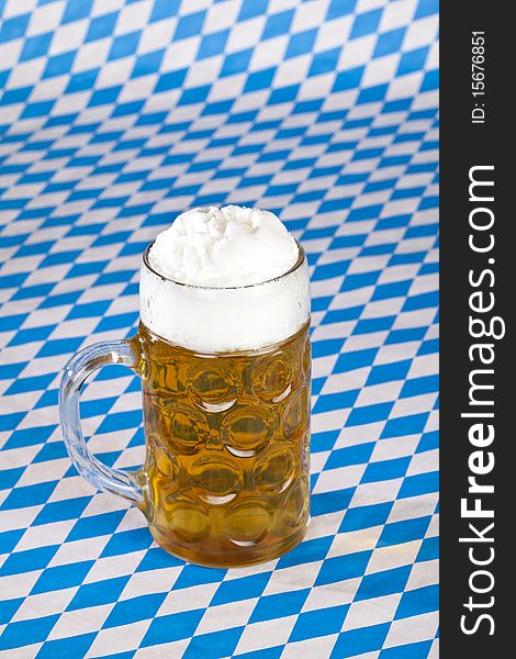Oktoberfest beer stein on Bavarian flag