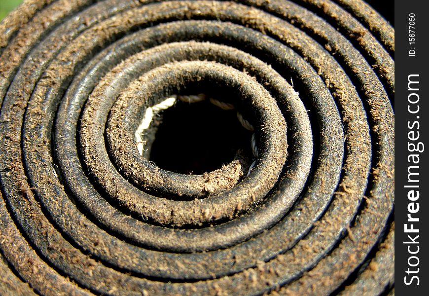 Detail photo of the rolled leather belt background. Detail photo of the rolled leather belt background