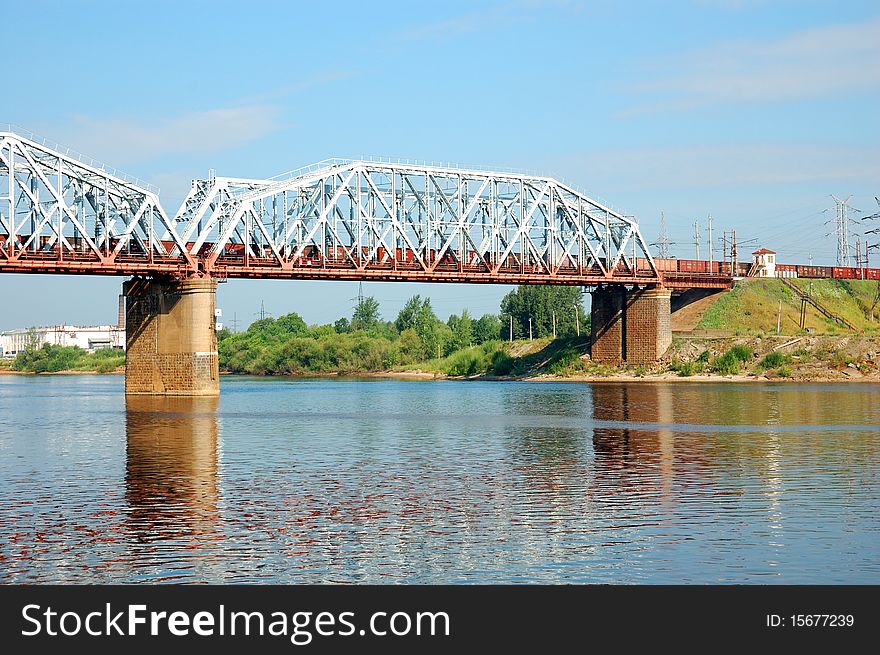 Railway bridge with freight train over the Volga river, Russia