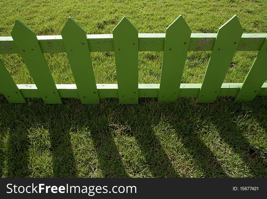 Shadow of wood fence in farm