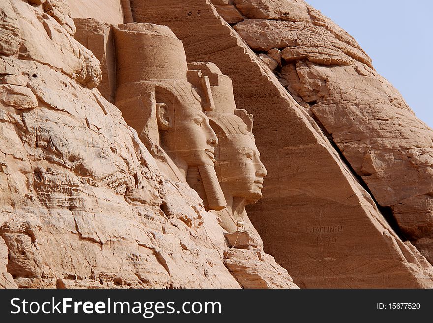 Abu Simbel temples are two massive rock temples in Nubia, southern Egypt on the western bank of Lake Nasser about 230 km southwest of Aswan (about 300 km by road). The complex is part of the UNESCO World Heritage Site known as the Nubian Monuments, which run from Abu Simbel downriver to Philae (near Aswan).