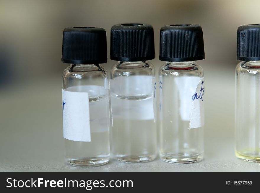 Four samples in laboratory glass. Four samples in laboratory glass