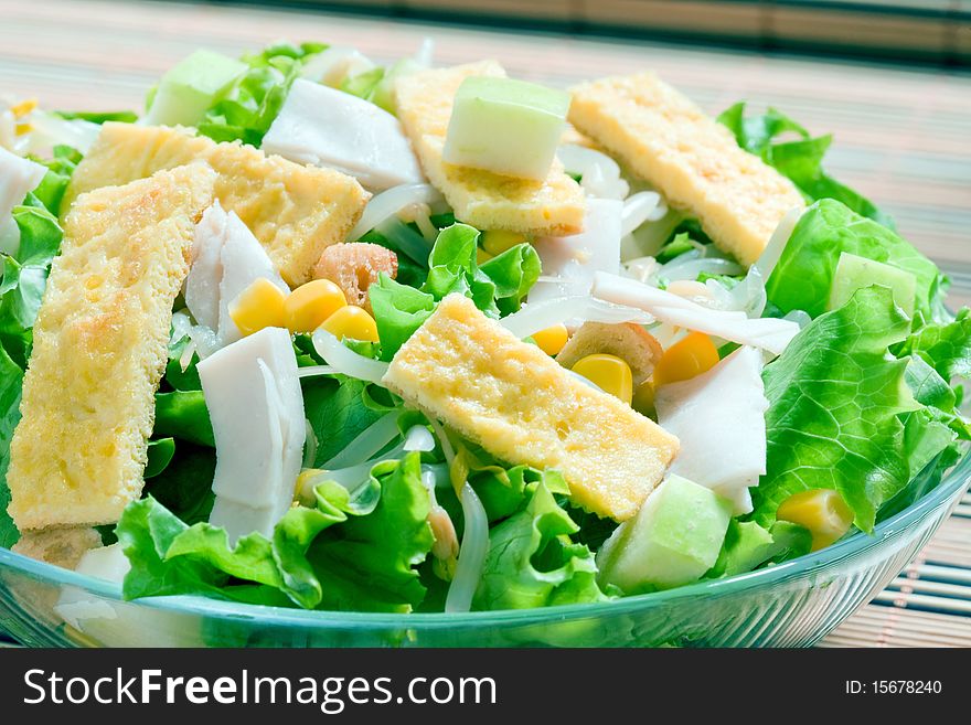 Corn salad with green lettuce and ham
