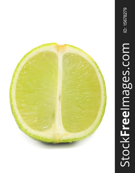 A lime cut in half isolated on a white background