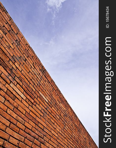 Line of brick wall and sky