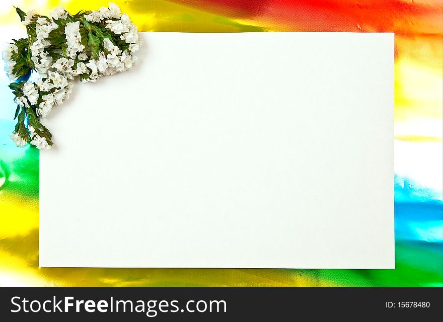 White paper blank on red with flowers design. Colored background