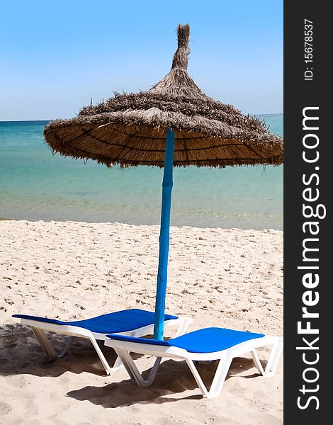 Straw Umbrella On The Beach