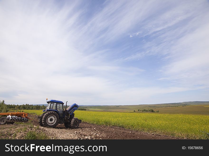 Plow machine in summer fields in China