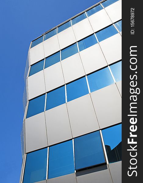 Abstract corner of an office building with reflective glass. Abstract corner of an office building with reflective glass