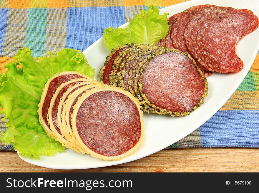 Various kinds of salami : with cheese and pepper with plate decoration. Various kinds of salami : with cheese and pepper with plate decoration