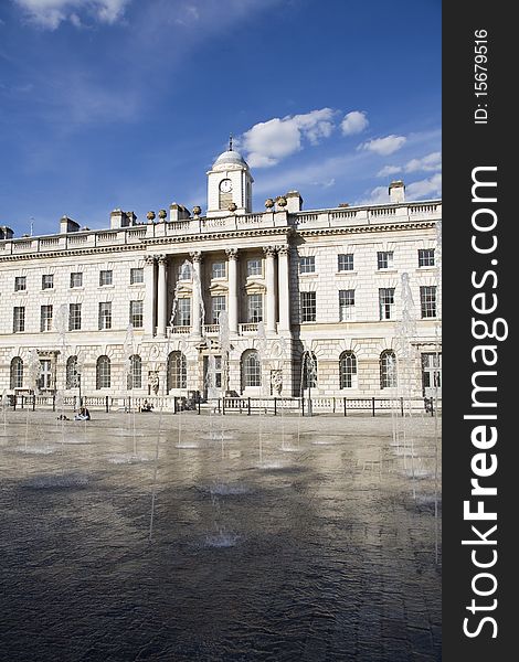 People relaxing near fountain and beautiful architecture of square from London UK Europe. People relaxing near fountain and beautiful architecture of square from London UK Europe