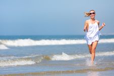 Woman Running On The Beach Stock Photos Woman Running On The Beach Stock Photos