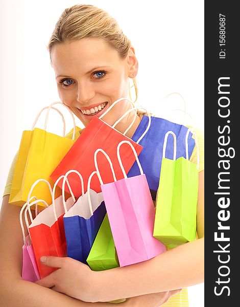 Beautiful blond girl holding a lot of colored bags. Beautiful blond girl holding a lot of colored bags