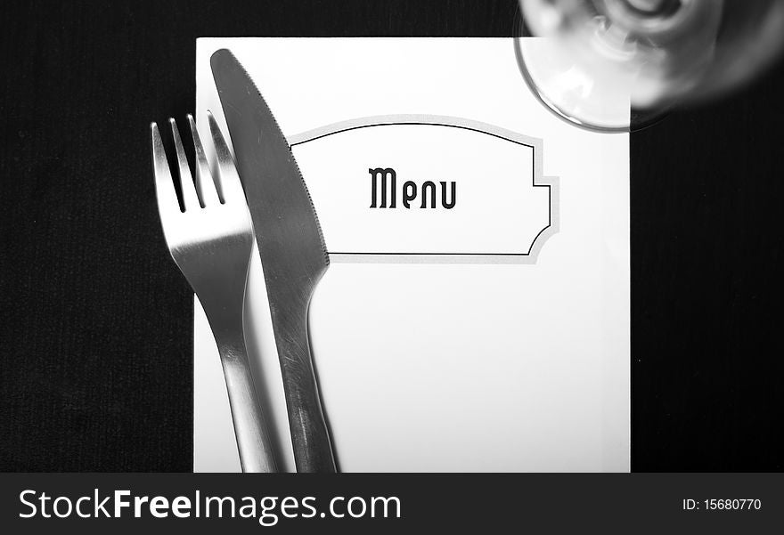 Silverware and a menu on a restaurant table