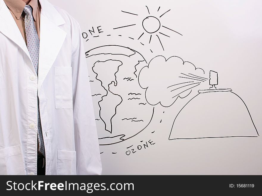 Man in a white lab coat standing next to a drawing of the ozone layer being in danger. Man in a white lab coat standing next to a drawing of the ozone layer being in danger.