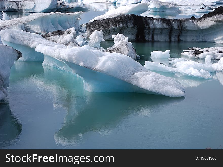 Icebergs floating in the glacial lagoon at JÃ¶kulsÃ¡rlÃ³n in Iceland