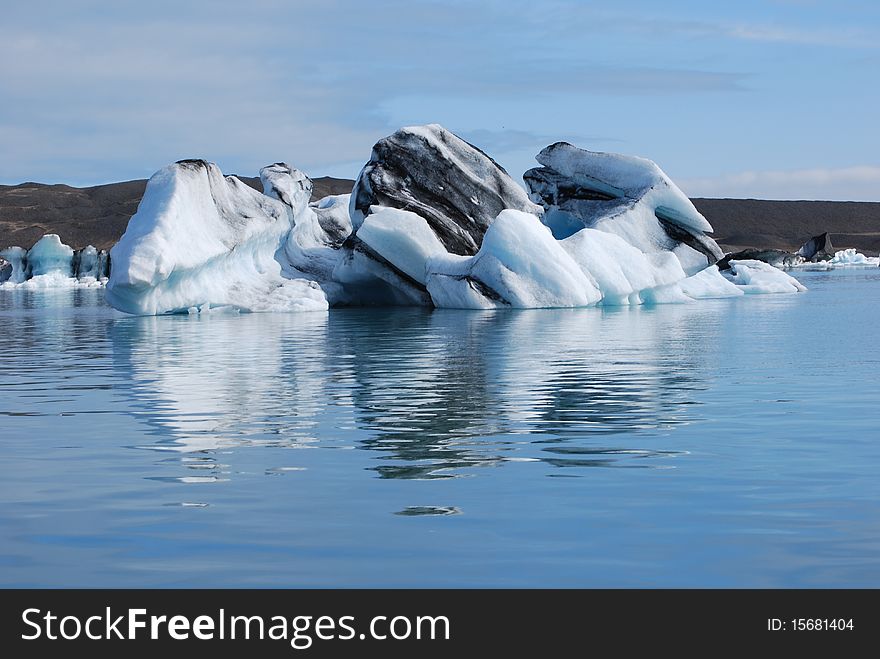 Icebergs floating in the glacial lagoon at JÃ¶kulsÃ¡rlÃ³n in Iceland