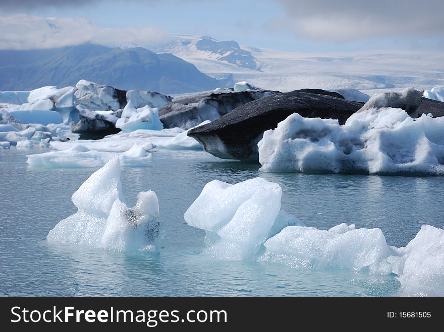 Icebergs floating in the glacial lagoon at JÃ¶kulsÃ¡rlÃ³n in Iceland