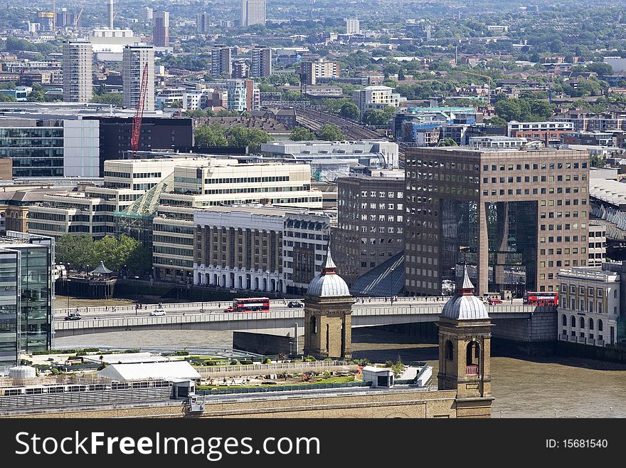 Buses Crossing Tower Bridge And Buildings