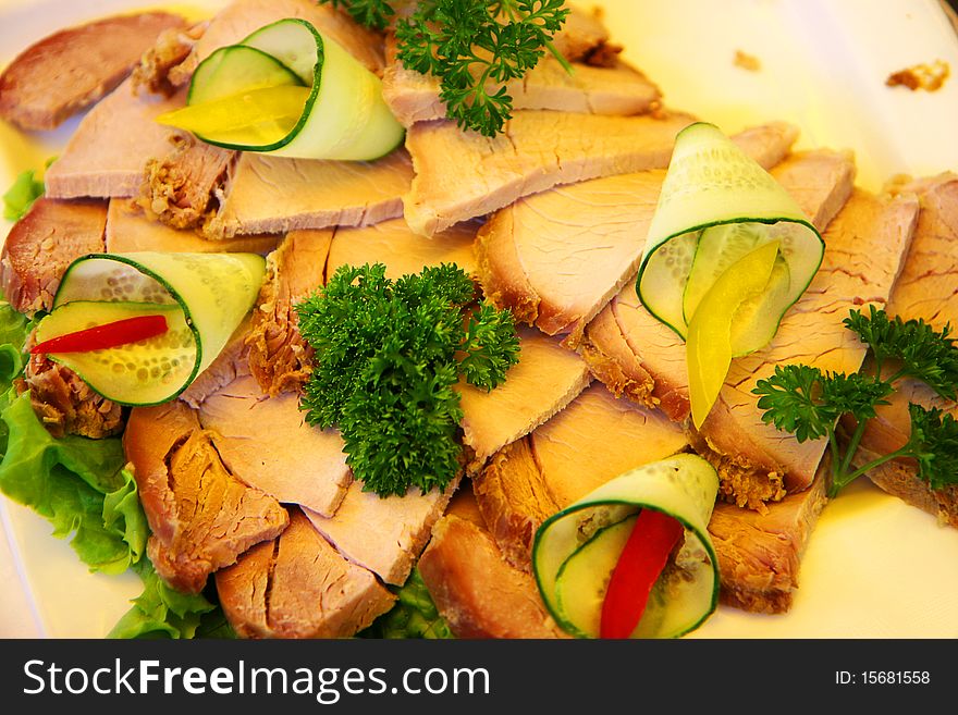 Meat platter decorated with vegetables