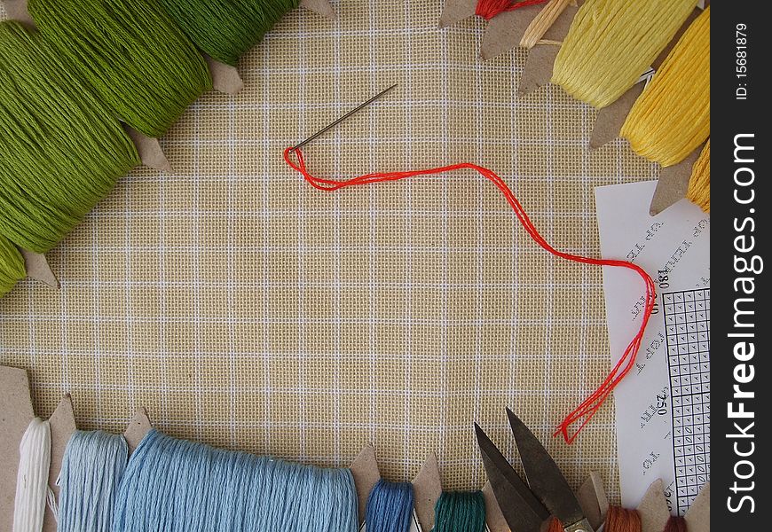 Scissors, color thread, needle and canvas for gobelins (arras). Scissors, color thread, needle and canvas for gobelins (arras)