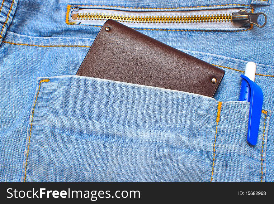 Wallet halfway out from a jeans back pocket. Wallet halfway out from a jeans back pocket