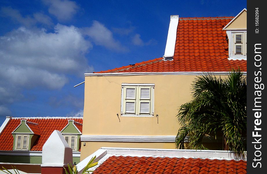 Brightly colored buildings with red clay tile roofs in Punda, Willemstad, Curacao. Brightly colored buildings with red clay tile roofs in Punda, Willemstad, Curacao