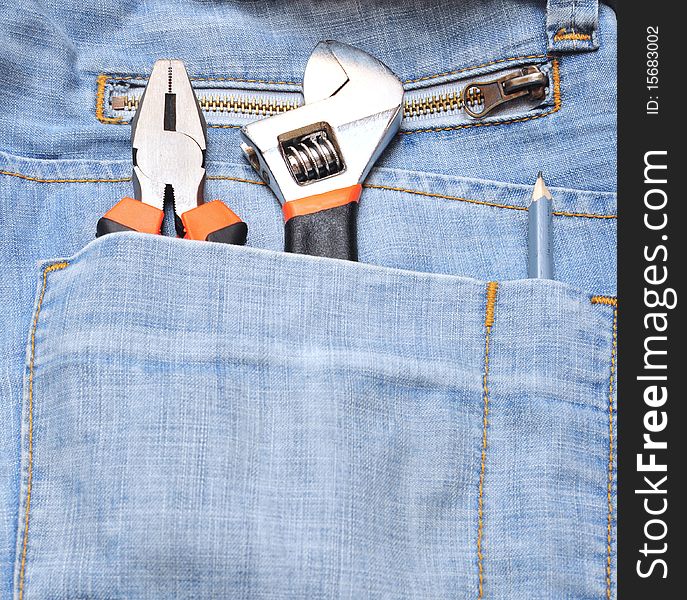 Tools in a blue jeans pocket