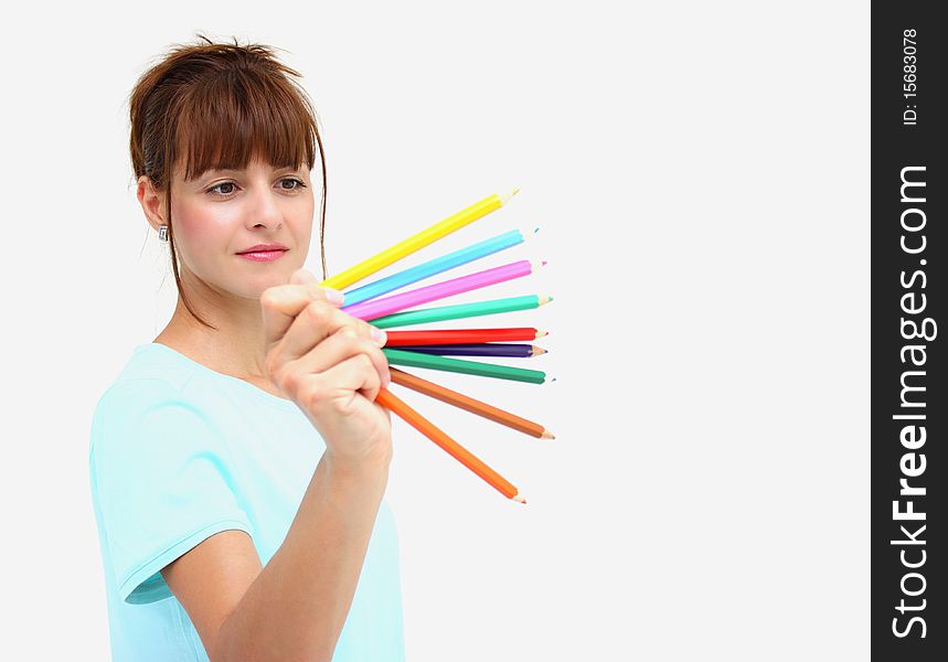 A woman holding colorful pencils isolated on a white background. A woman holding colorful pencils isolated on a white background