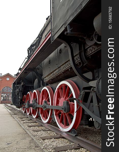 Old locomotive wheels close up. Steam train.