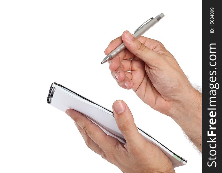 Notebook and pen in hand on a white background. Notebook and pen in hand on a white background