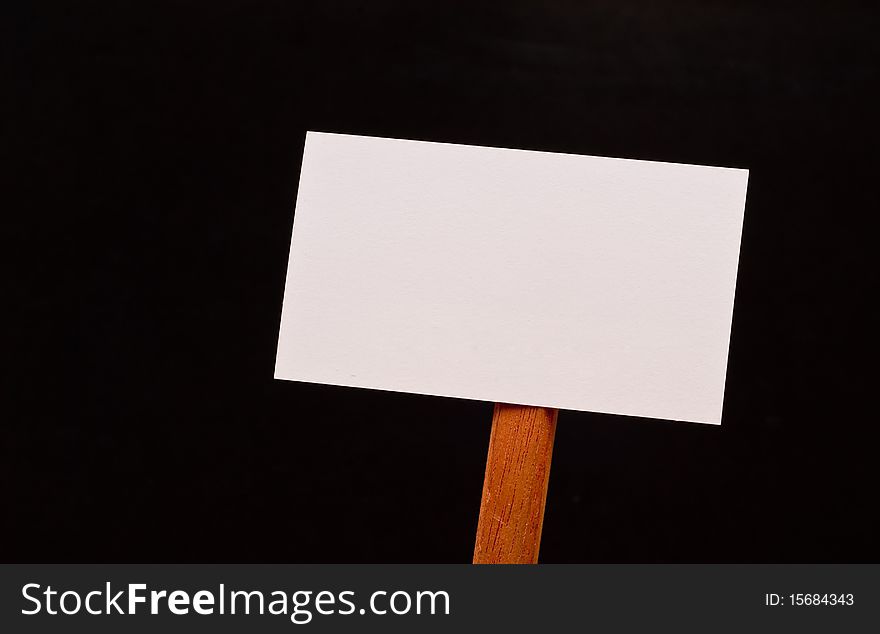 Blank Sign on Wood Stick on Black