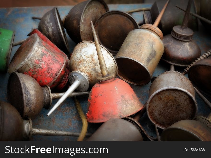 A group of vintage oil cans.