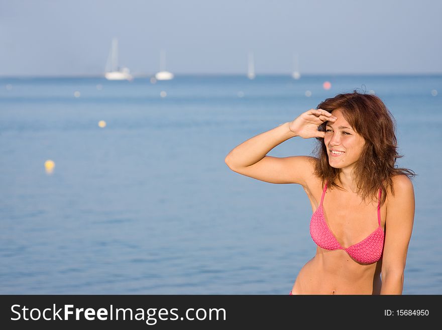 Beautiful dark-haired girl looks into the distance