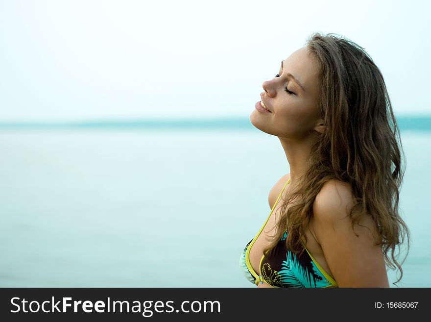 Attractive woman relaxing on sunset in the sea. Attractive woman relaxing on sunset in the sea