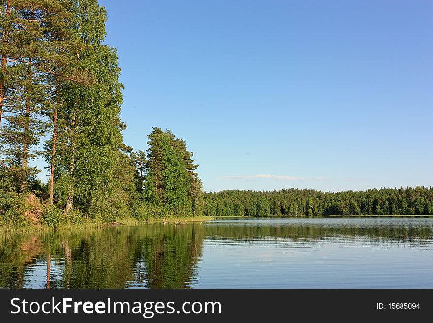 Northern lake and forest at summer. Northern lake and forest at summer