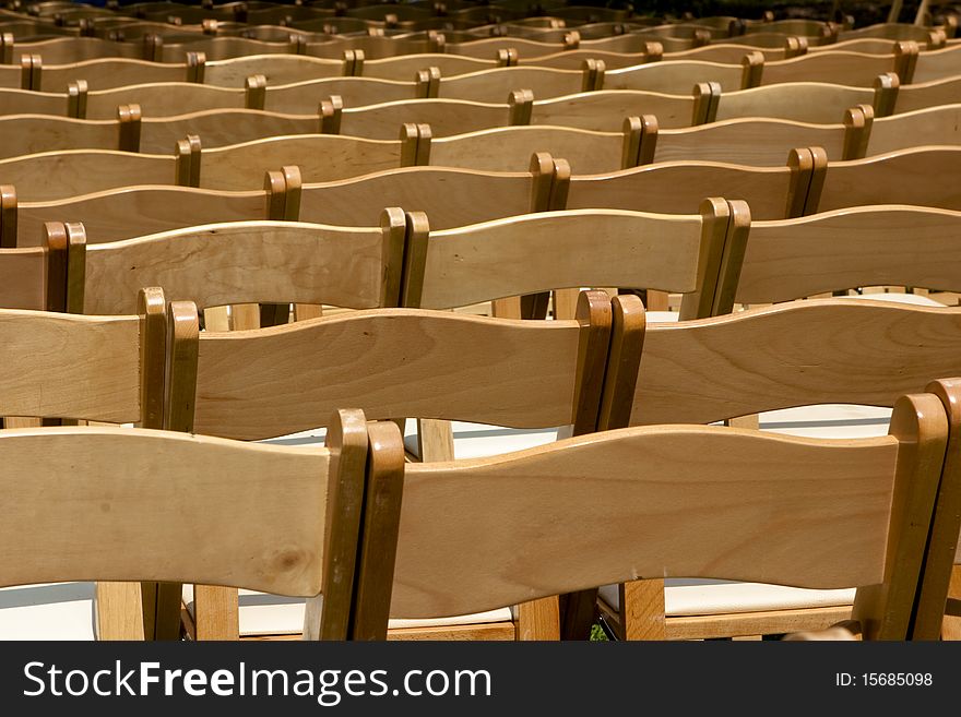 Rows of wooden chairs background image. Rows of wooden chairs background image