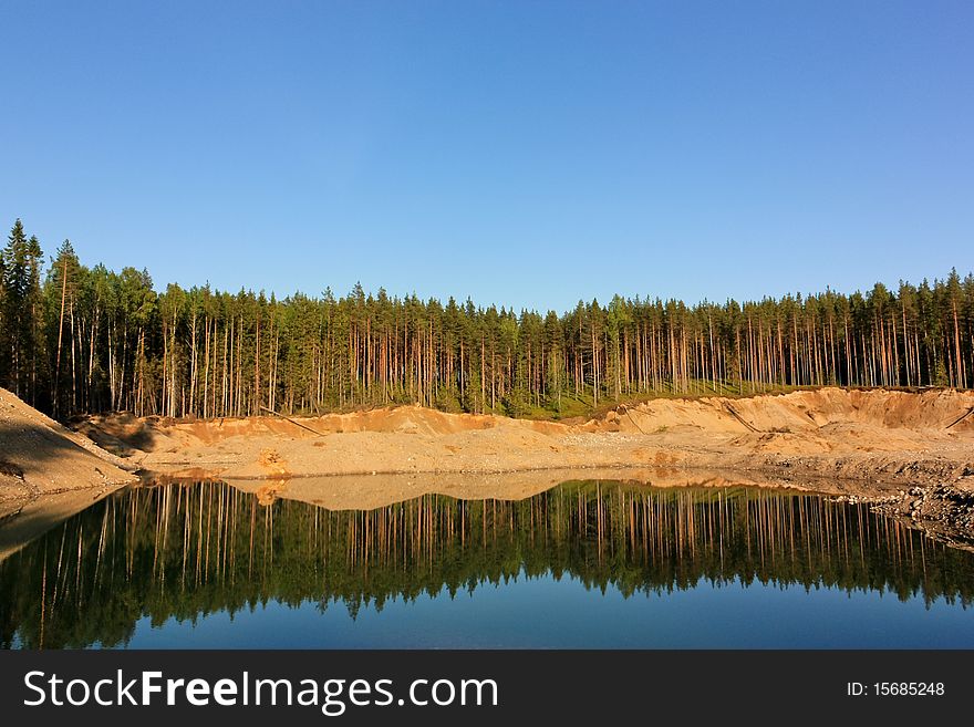 Water of an open-cast mine at summer