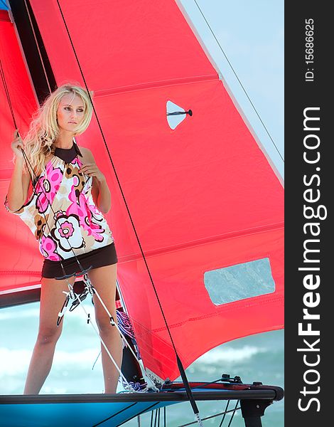 Young attractive girl on yacht