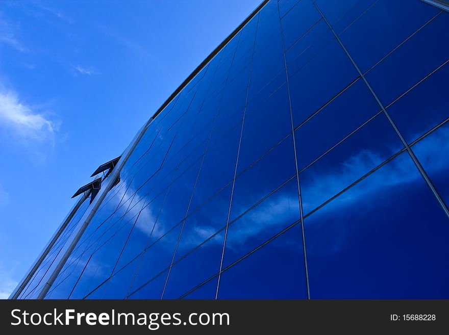 Natural blue sky reflected on office building. Natural blue sky reflected on office building