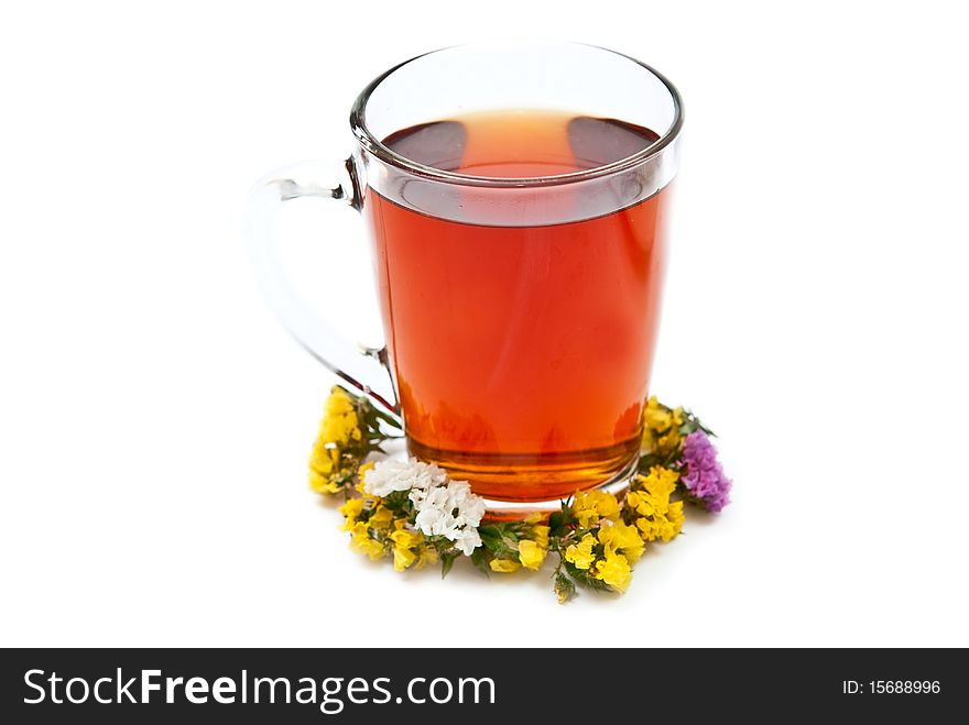Cup of tea with flowers isolated on white