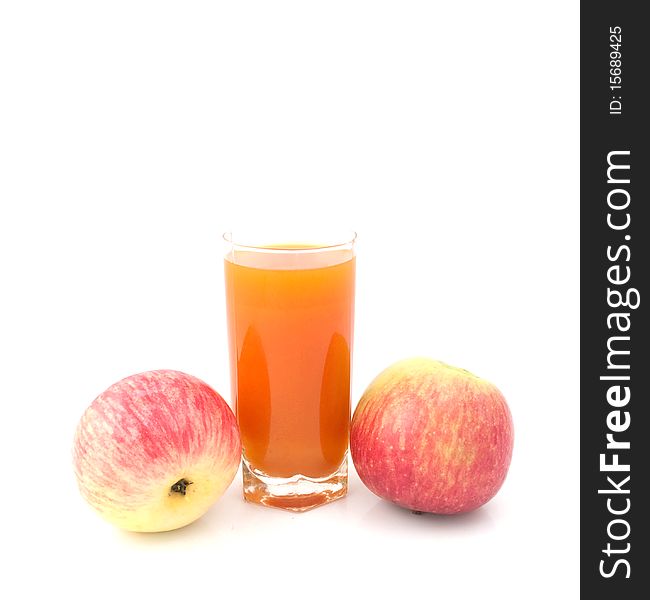 Glass of juice with  apples on a white background